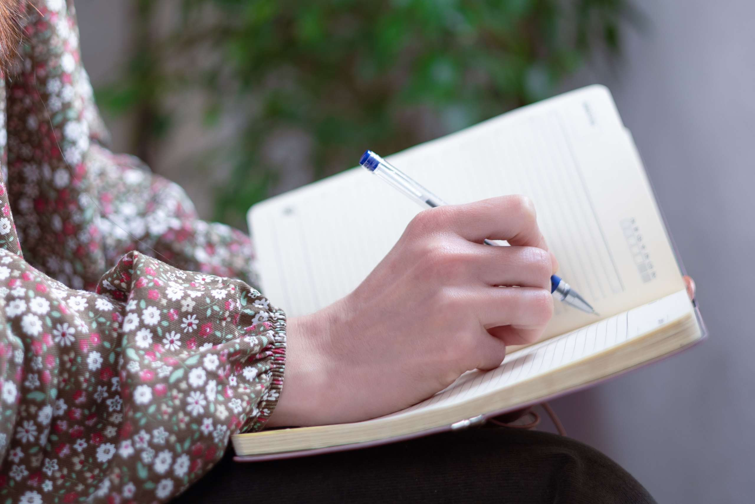 woman holding a notebook