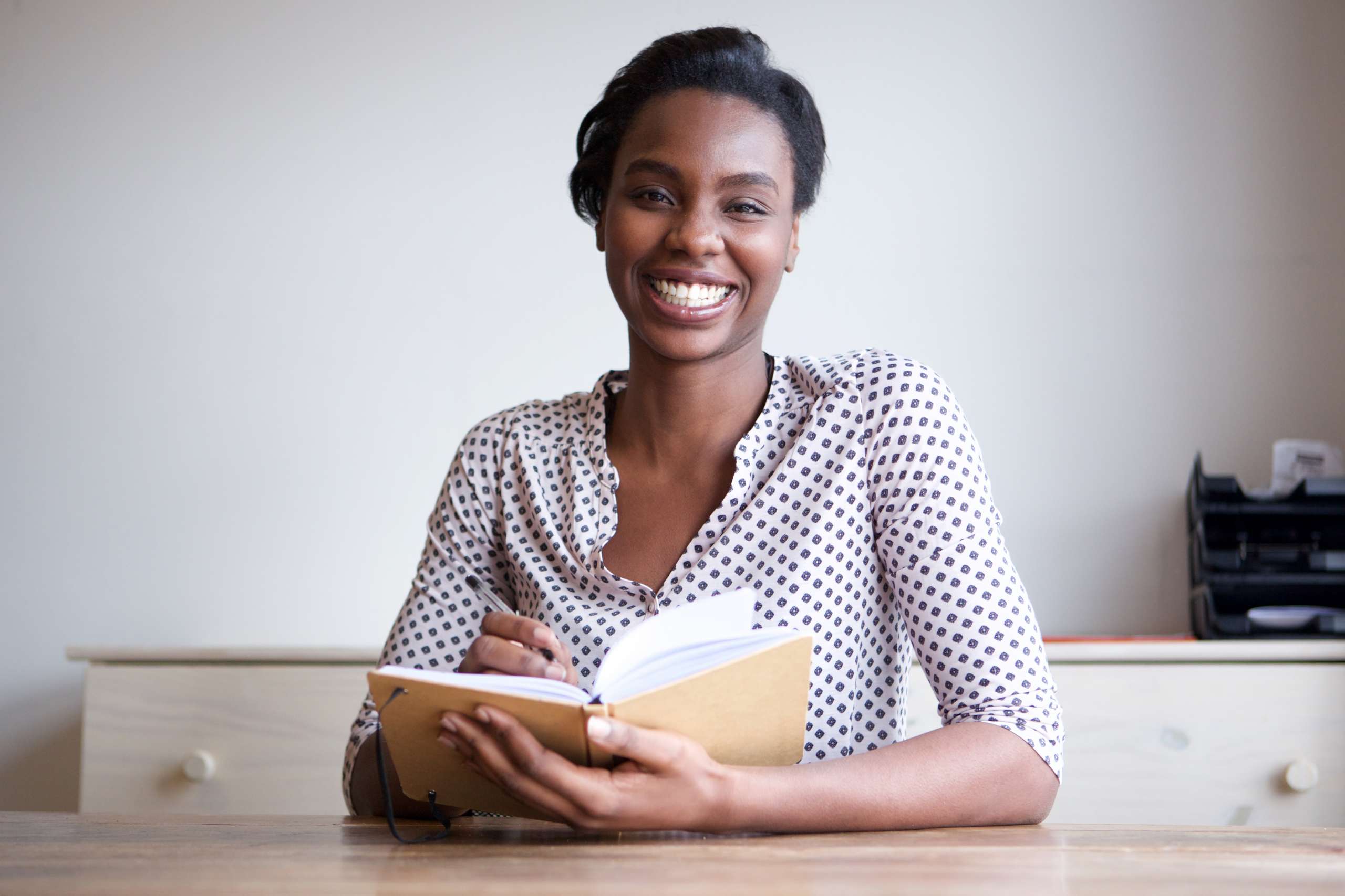 smiling woman and writing