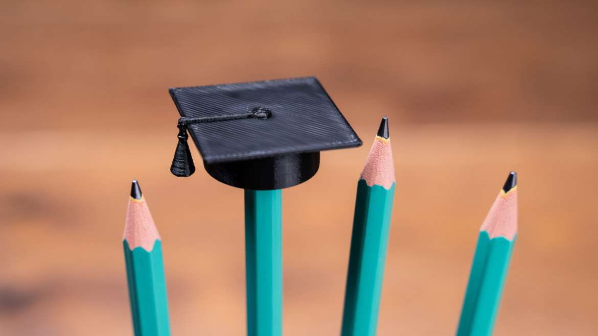 Graduate hat mounted on pencil
